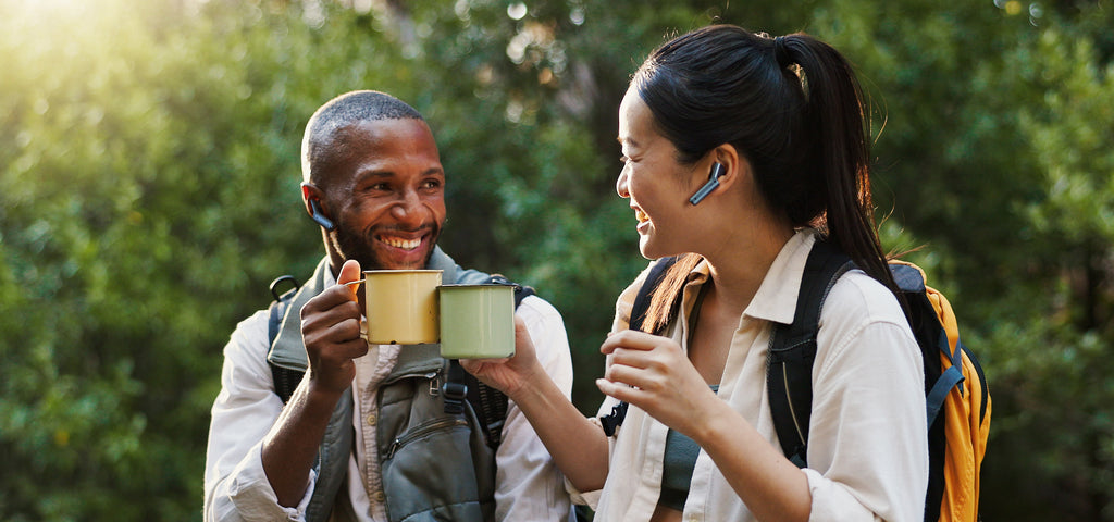 two people wearing Timekettle W4 to have cross-language communication naturally