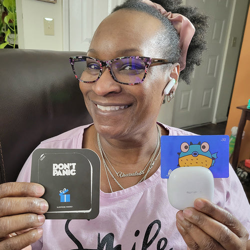 A woman showing the translating earbuds5